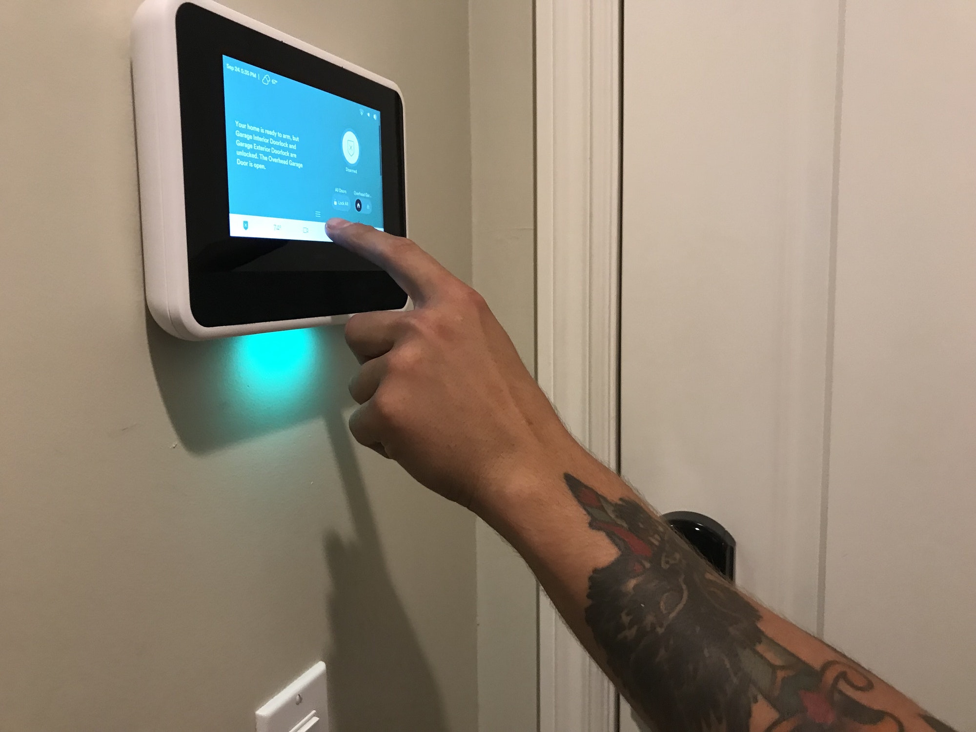 A Technician gives instructions on Programming the home security panel in a smart home.