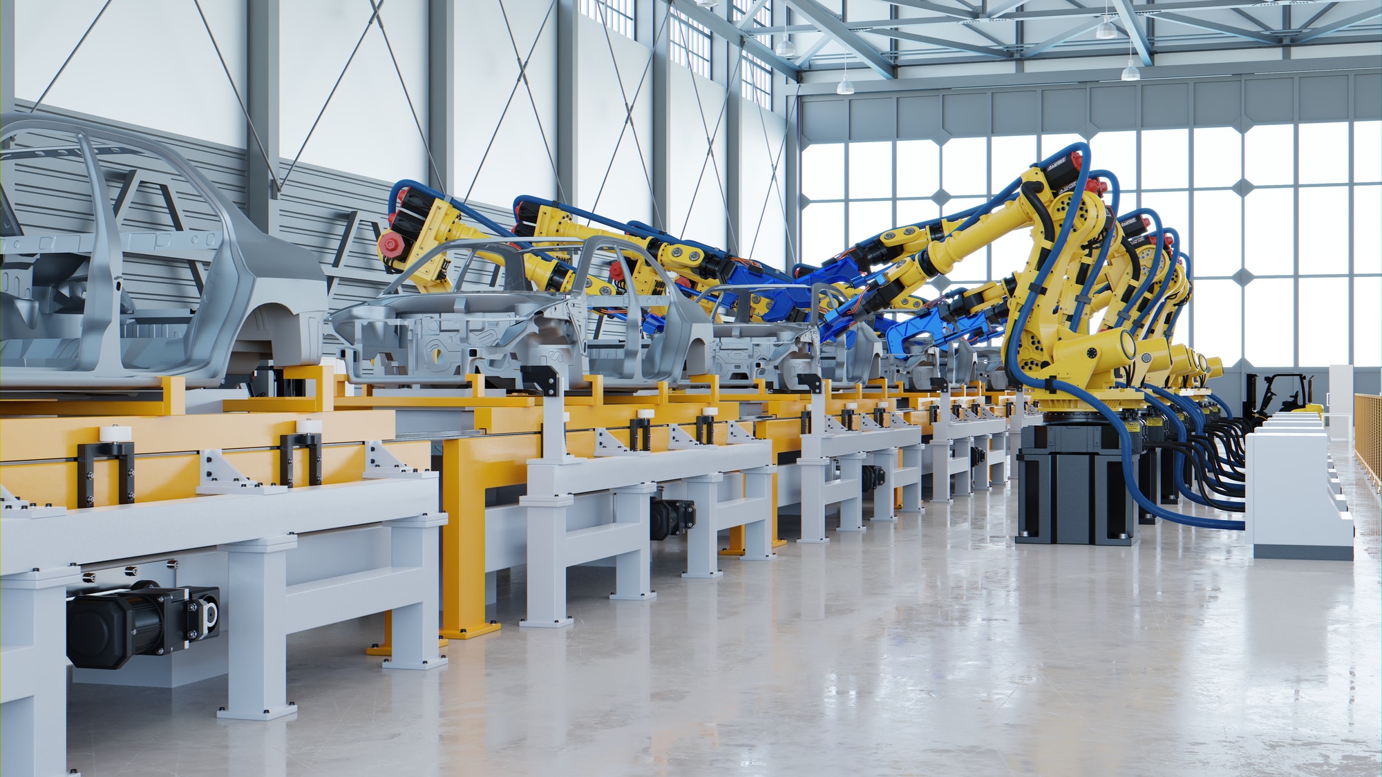 Robotic automotive assembly in factory.