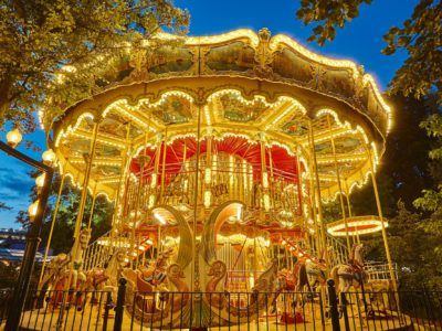 Merry go round carousel childhood entertainment. Vintage playground attraction. Adorable