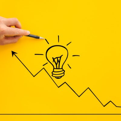Businessman pointing lightbulb and arrow growth with pen. Business start-up goals to success and id
