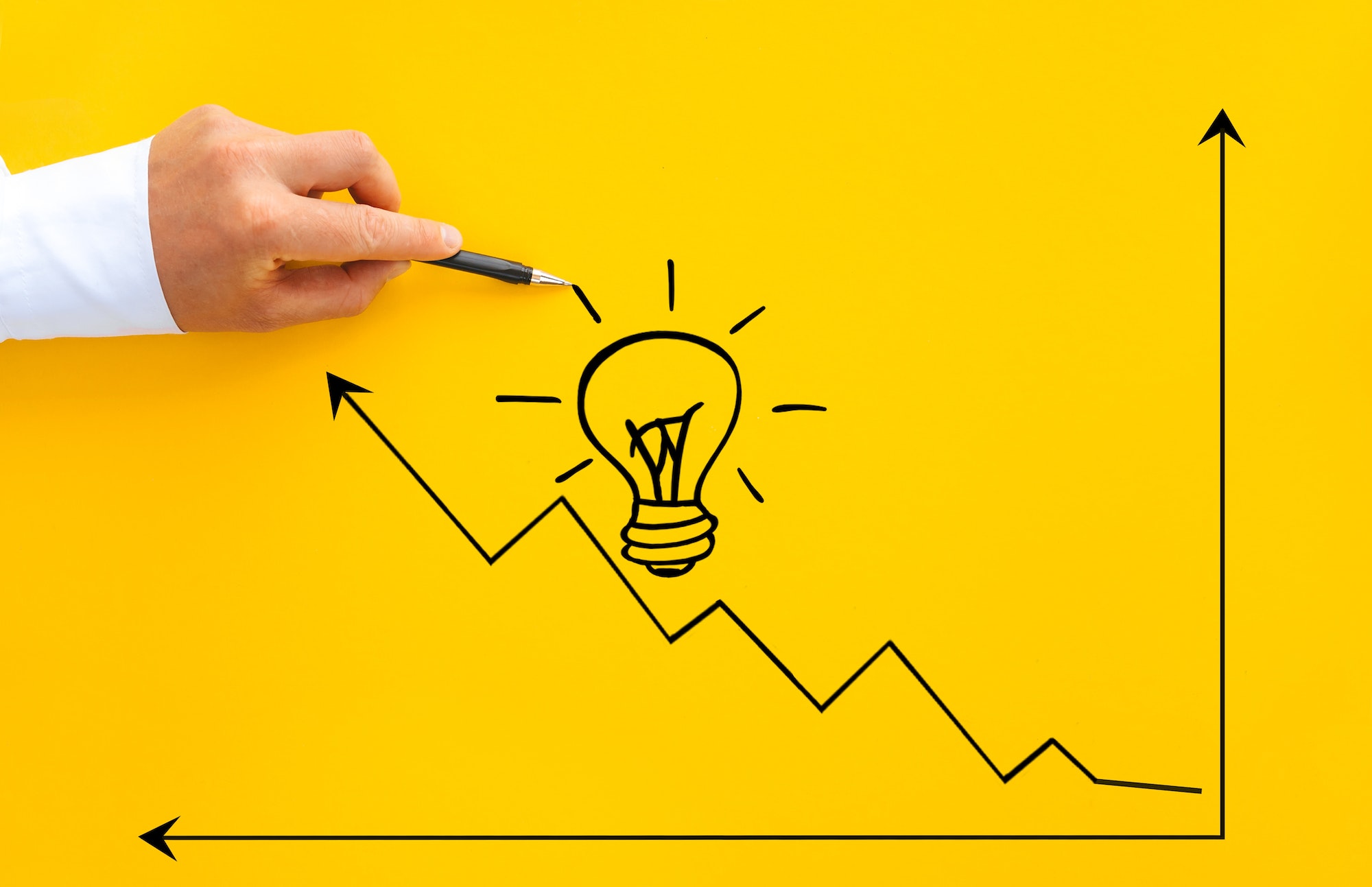 Businessman pointing lightbulb and arrow growth with pen. Business start-up goals to success and id