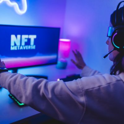 Young gamer buying NFT for metaverse virtual video game online - Focus on augmented reality goggles